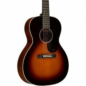A Concert Body Shaped Martin 00 guitar. This guitar is against a white background and is a vintage sunburst color.