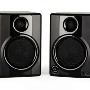 A pair of studio monitors against a white back drop