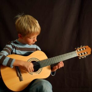 Kid Playing Nylon String Guitar