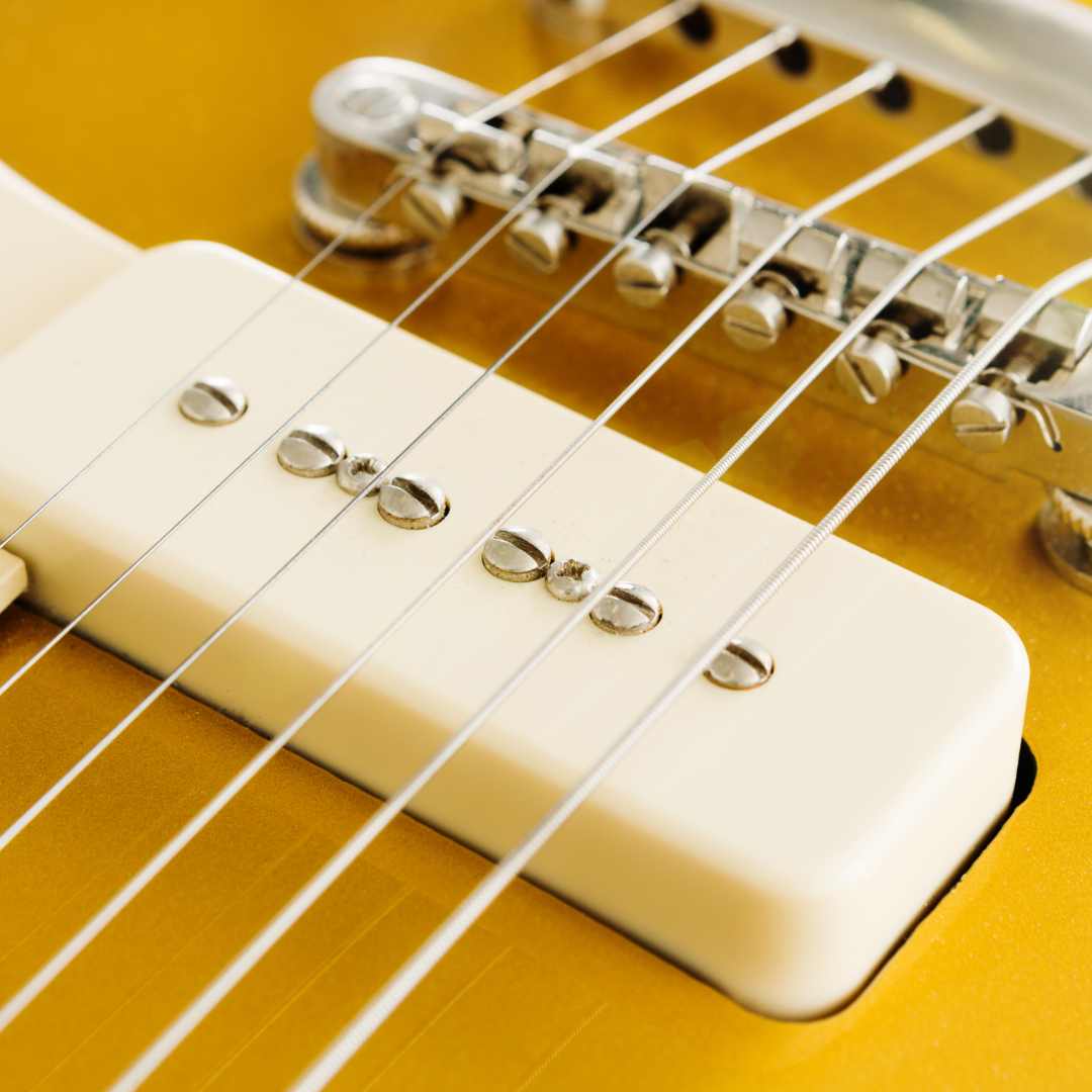 P90 soapbar style pickups in a gold top gibson les paul electric guitar.