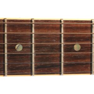 A closeup picture of a guitar fretboard made with Indian Rosewood.