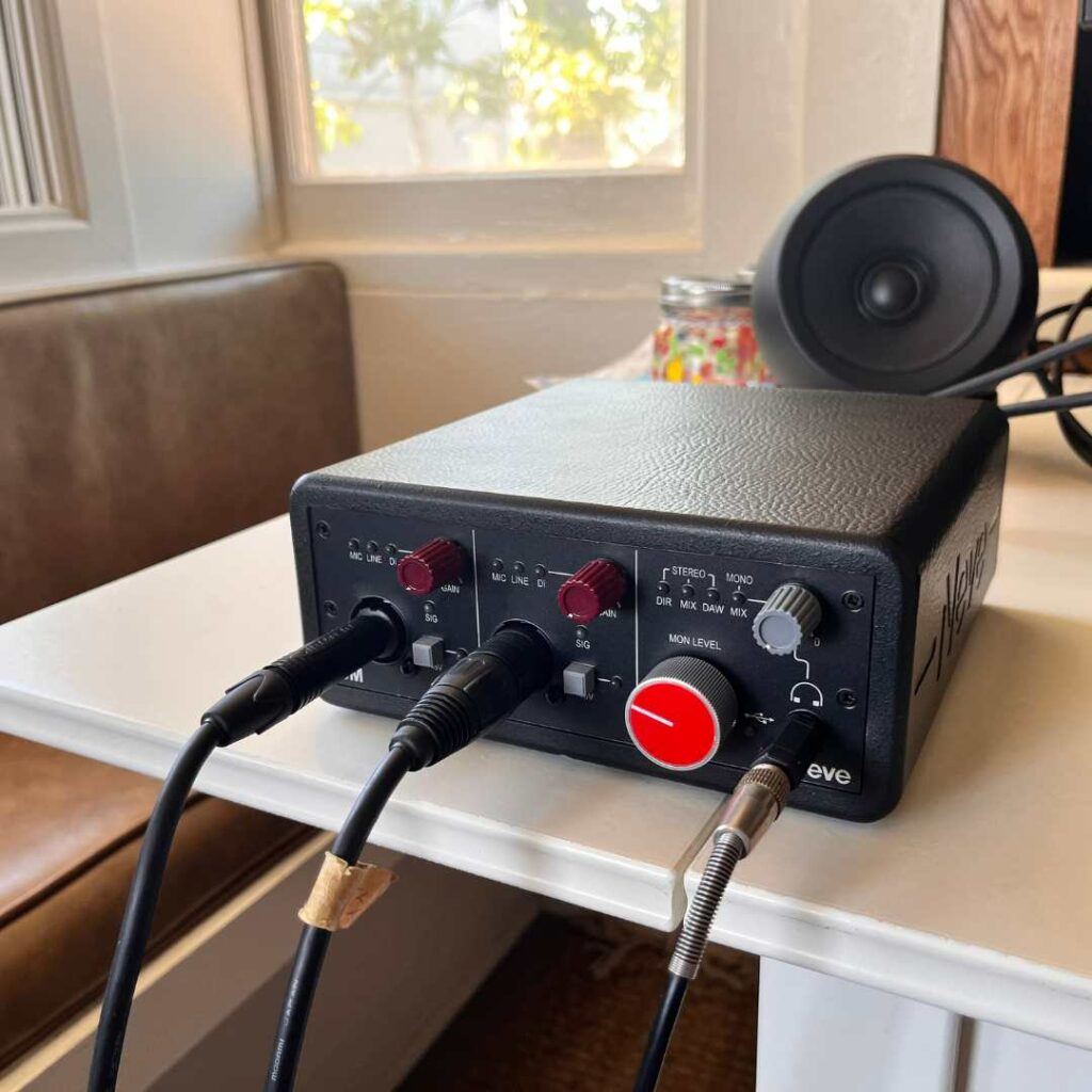 This image shows the Neve 88M on a desk with the cables coming out the front. This is to illustrate that cable management can be a little difficult with this design.